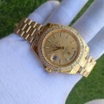 rolex-day-date-40-presidential-champagne-dial-diamond-bezel-president-bracelet-yellow-353_720x.jpg