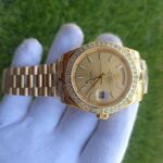 rolex-day-date-40-presidential-champagne-dial-diamond-bezel-president-bracelet-yellow-353_720x.jpg